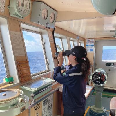 Nameun Kim surveys the horizon from the deck of a ship, March 2023. International Maritime Organization