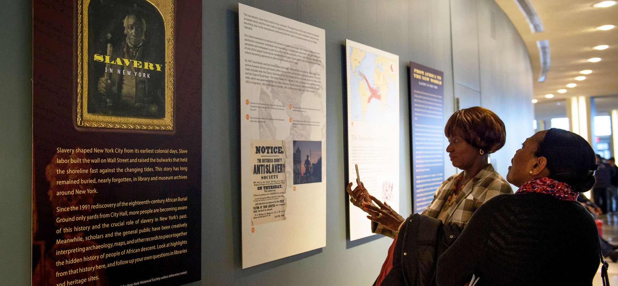 Two women look at an exhibit