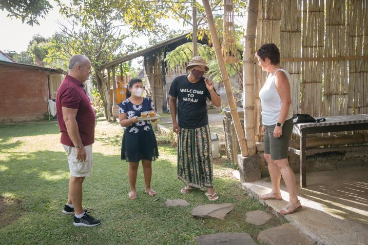 Four people talking outdoors