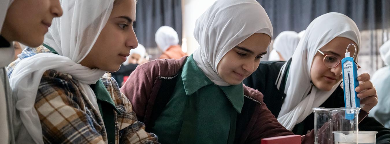 A group of girls attending a science class at the Wihdat camp for Palestinian refugees in Amman, Jordan.