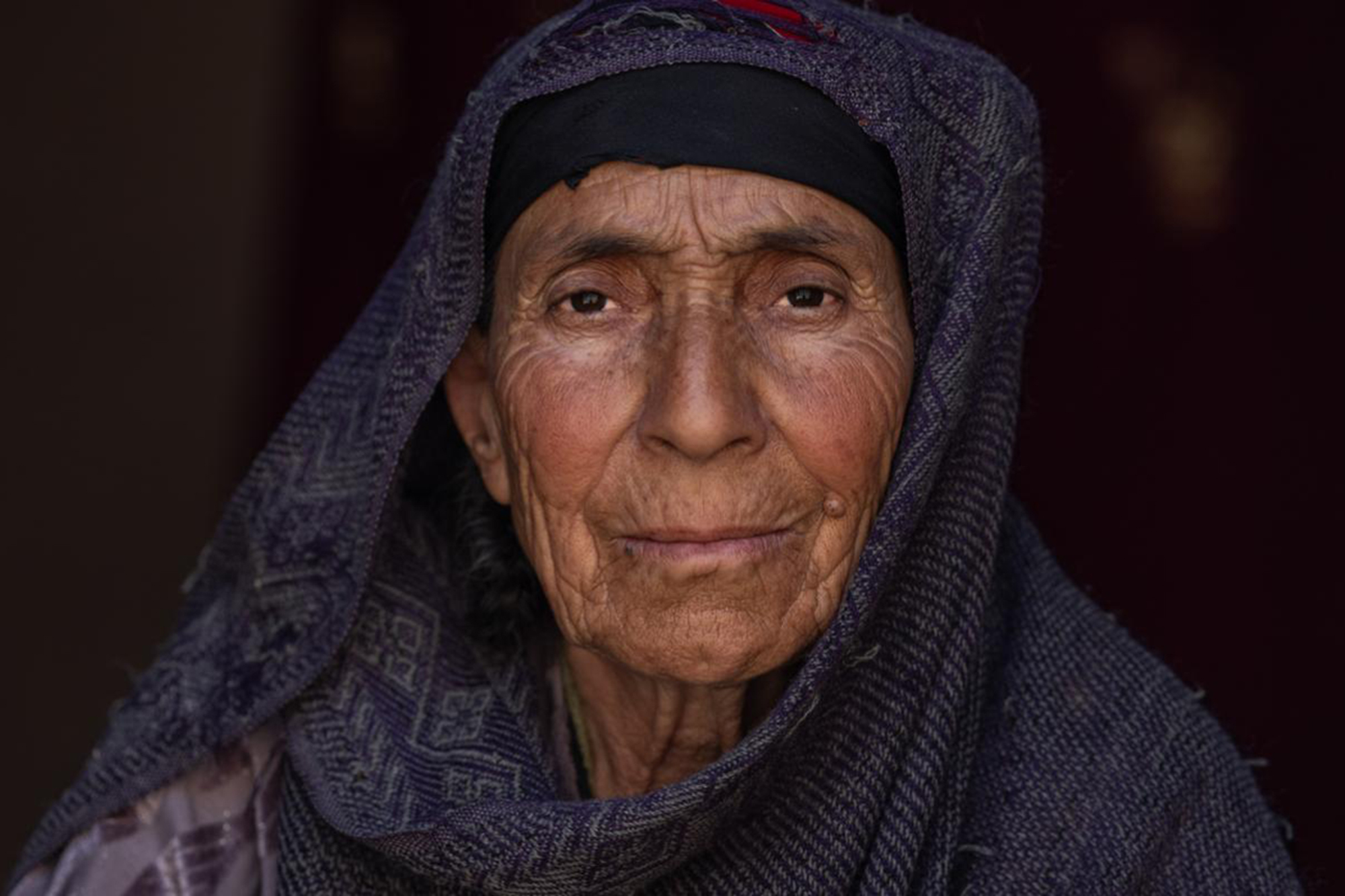 Close-up of a woman affected by severe flooding in Afghanistan.