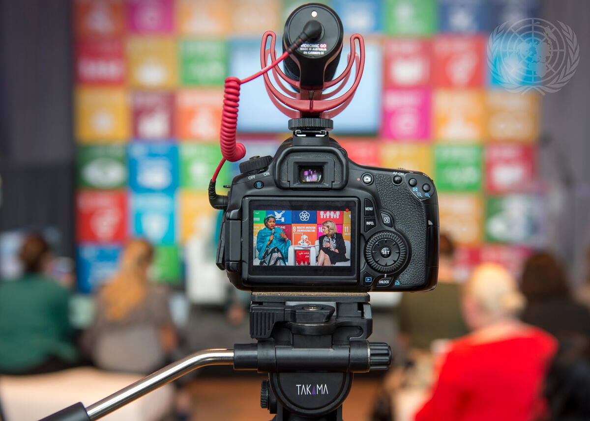 Camera filming the conversation of two women at an interview