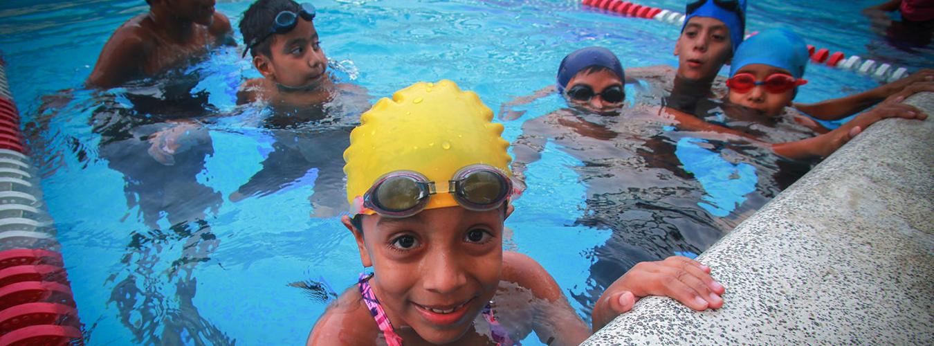 Children swim in a local recreation centre, El Salvador.