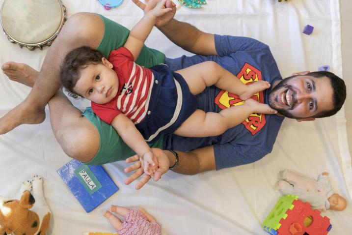 Father playing with his young daughter at home.