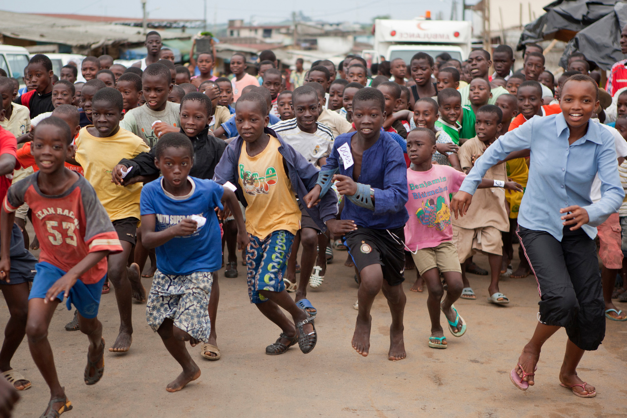 A group of kids running in a cross country race in Bonoua, Côte d'Ivoire.