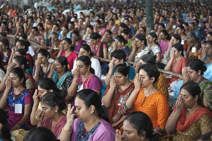 group of people practicing yoga breathing