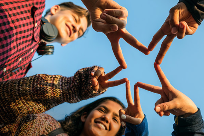 Children making a star sign